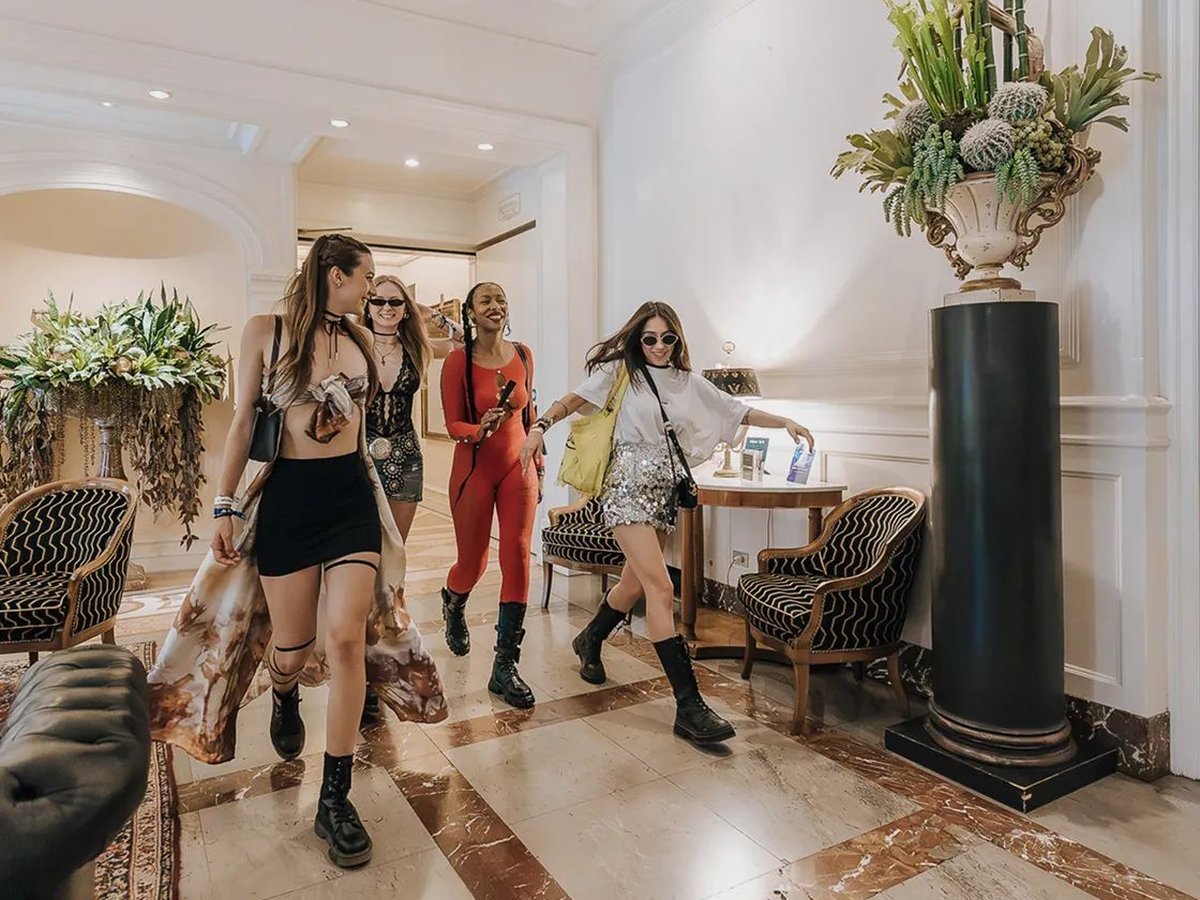 A group of guests crossing the hotel lobby